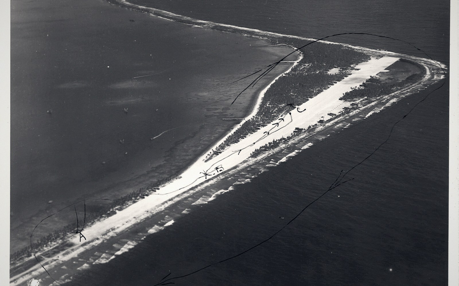 A small atoll airstrip that doubles as the flattest road, coral surface